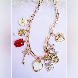 Gold Charm Necklace with Red and White Accents